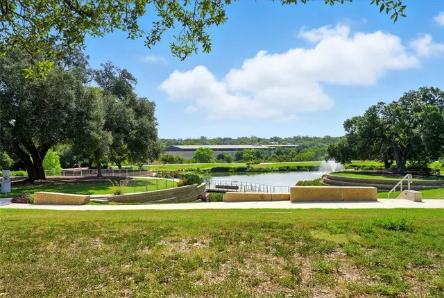 a view of a lake with a garden