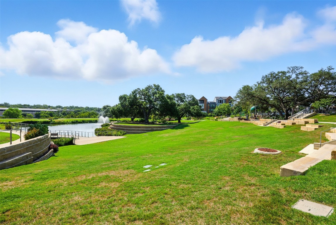4507 Unity Circle Austin, TX 78731 - Photo 30 of 37 View of community featuring a water view and a yard