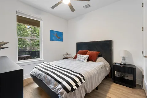 a view of a hallway and a livingroom with furniture