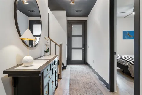 a bathroom with a sink a toilet and mirror