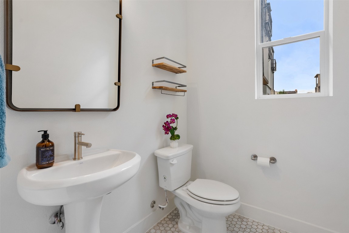 4507 Unity Circle Austin, TX 78731 - Photo 9 of 37 Half Bathroom featuring toilet and tile patterned flooring