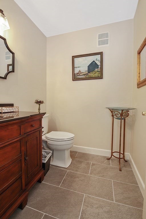 31 Draper Road Dover, MA 02030 - Photo 13 of 41 a bathroom with a toilet a sink and mirror