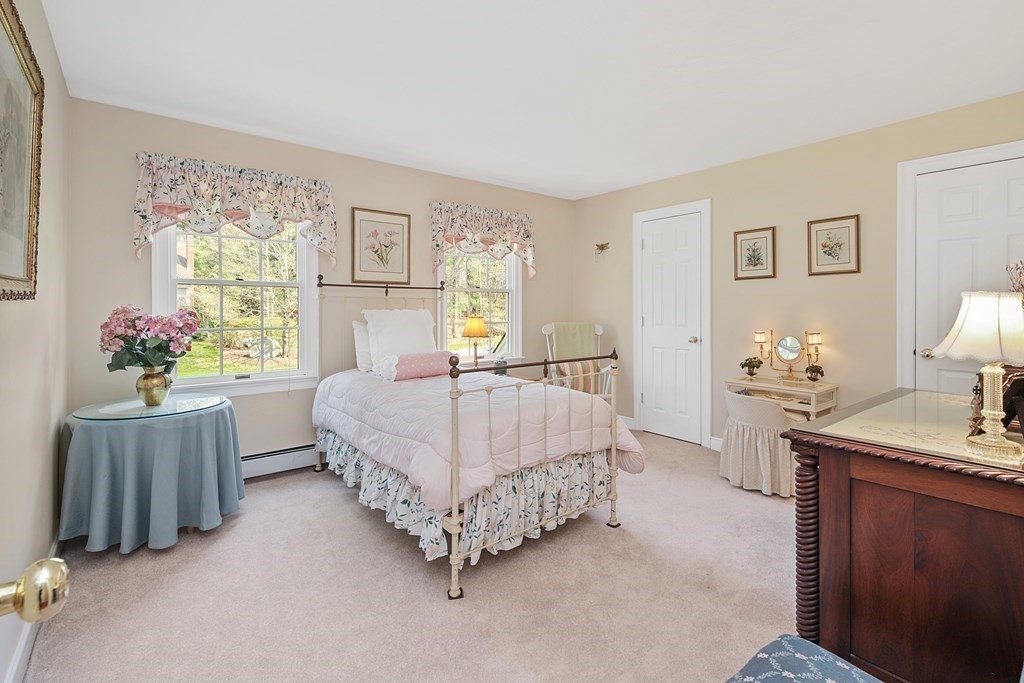 31 Draper Road Dover, MA 02030 - Photo 21 of 41 a bedroom with a bed table closet and a window