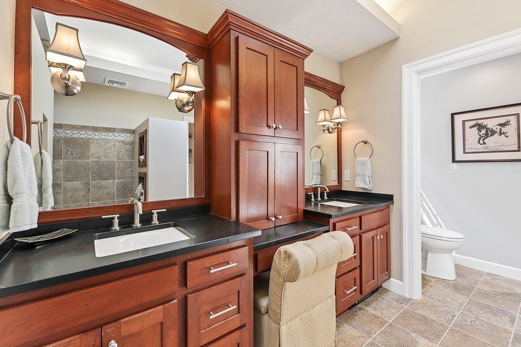 31 Draper Road Dover, MA 02030 - Photo 28 of 41 a bathroom with a sink a toilet and a mirror
