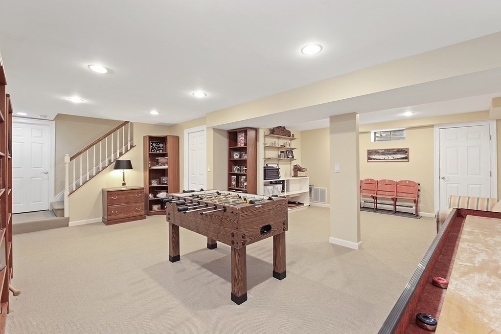 31 Draper Road Dover, MA 02030 - Photo 30 of 41 a living room with furniture a table and kitchen view