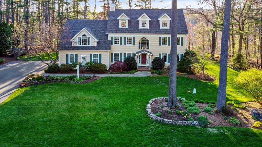 31 Draper Road Dover, MA 02030 - Photo 3 of 41 a front view of a house with garden