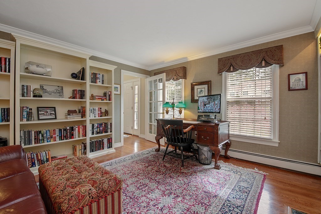31 Draper Road Dover, MA 02030 - Photo 9 of 41 a living room with furniture and a book shelf