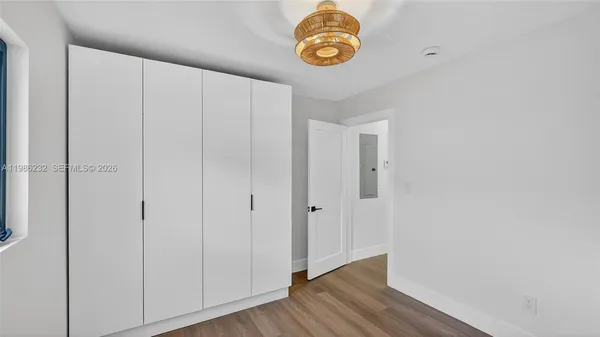 a view of room with wooden floor