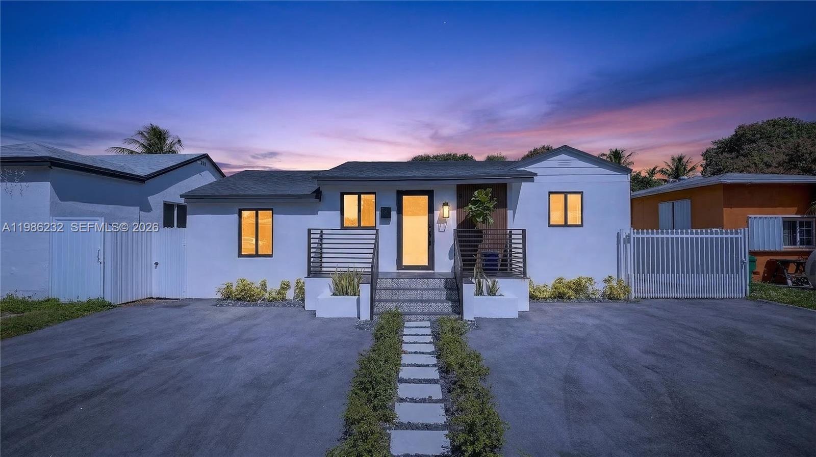 3135 Southwest 7th Street Miami, FL 33135 - Photo 2 of 20 a front view of a house with garden