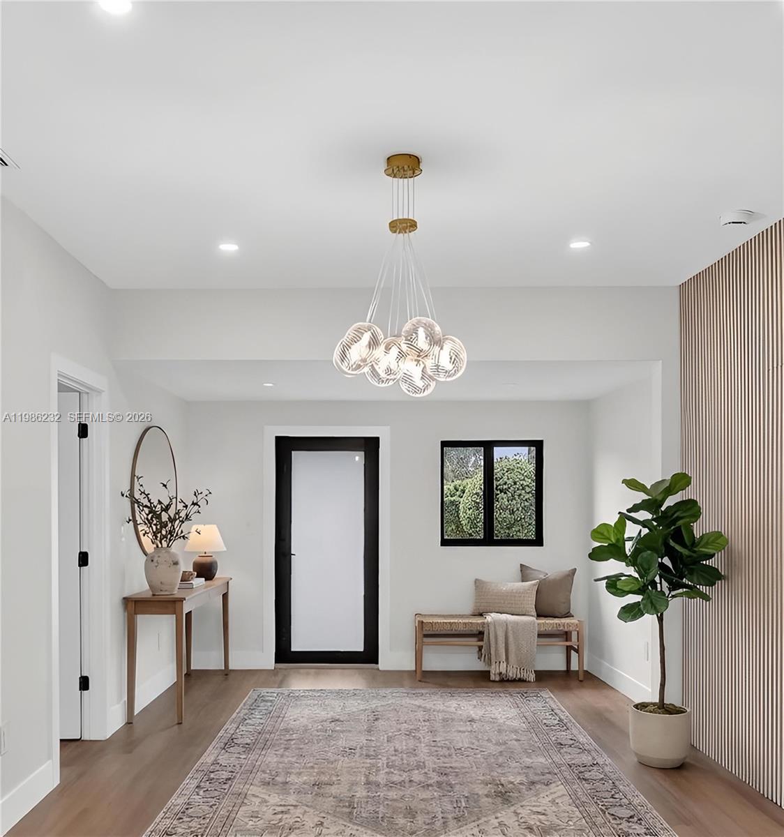 3135 Southwest 7th Street Miami, FL 33135 - Photo 4 of 20 a living room with furniture and a potted plant
