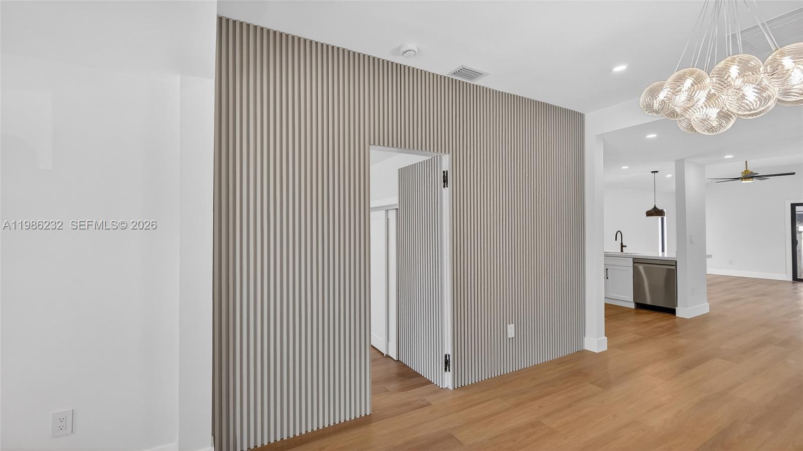 3135 Southwest 7th Street Miami, FL 33135 - Photo 7 of 20 a view of kitchen with refrigerator and window