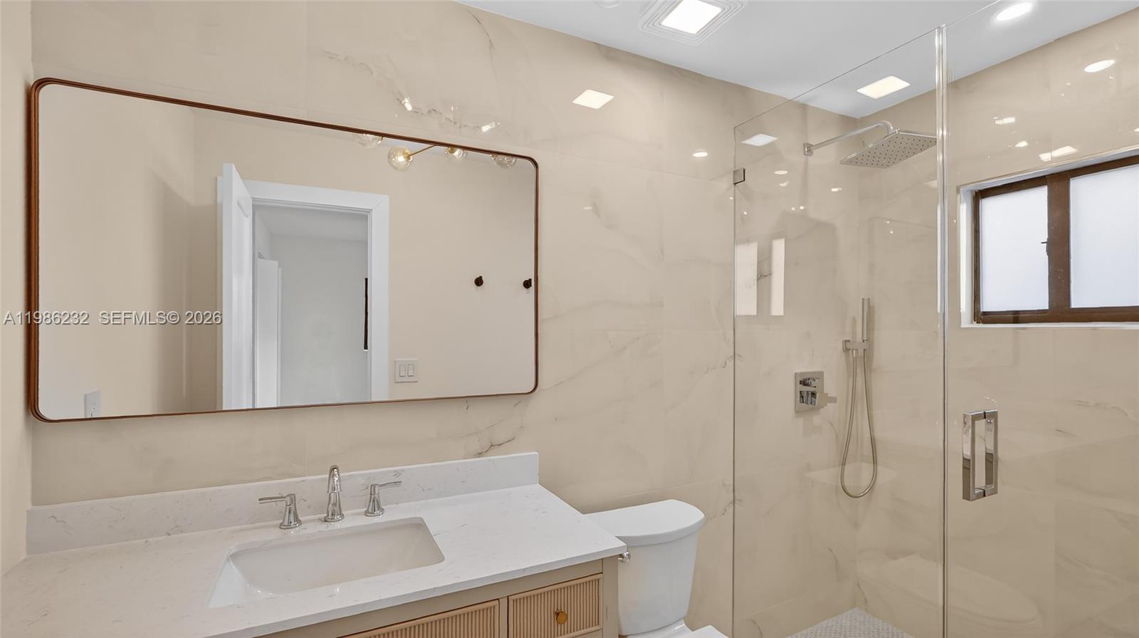 3135 Southwest 7th Street Miami, FL 33135 - Photo 9 of 20 a bathroom with a sink a toilet and shower