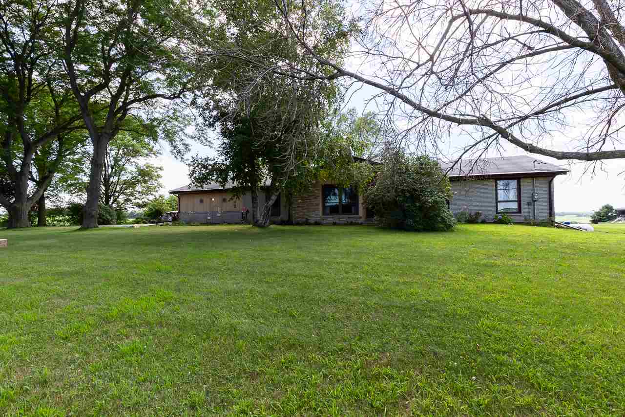 11218 Center Road Durand, IL 61024 - Photo 2 of 25 a front view of house with yard and green space