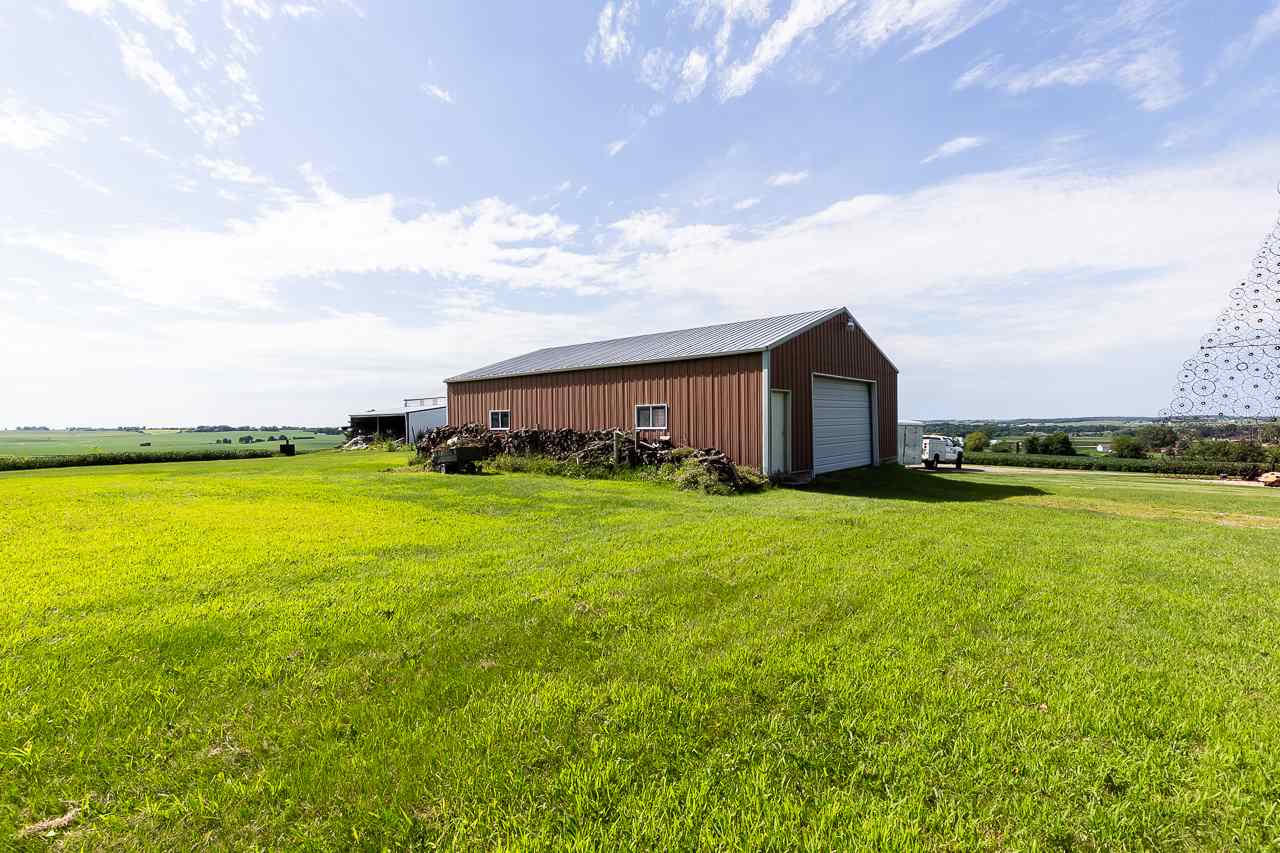 11218 Center Road Durand, IL 61024 - Photo 22 of 25 a view of a house with a yard