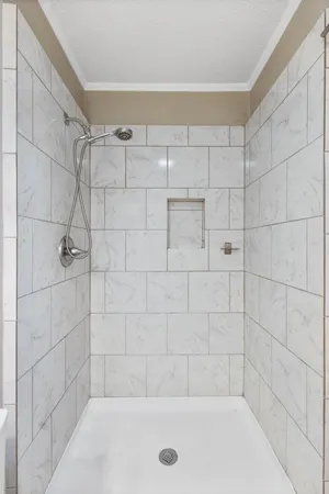 a bathroom with a shower and bathtub