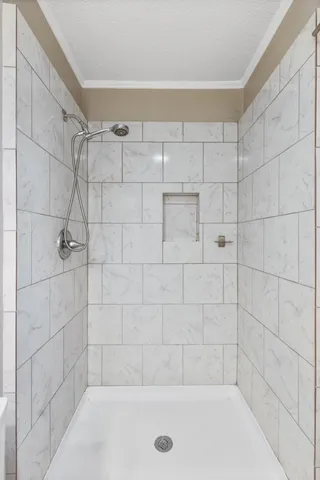 a bathroom with a shower and bathtub