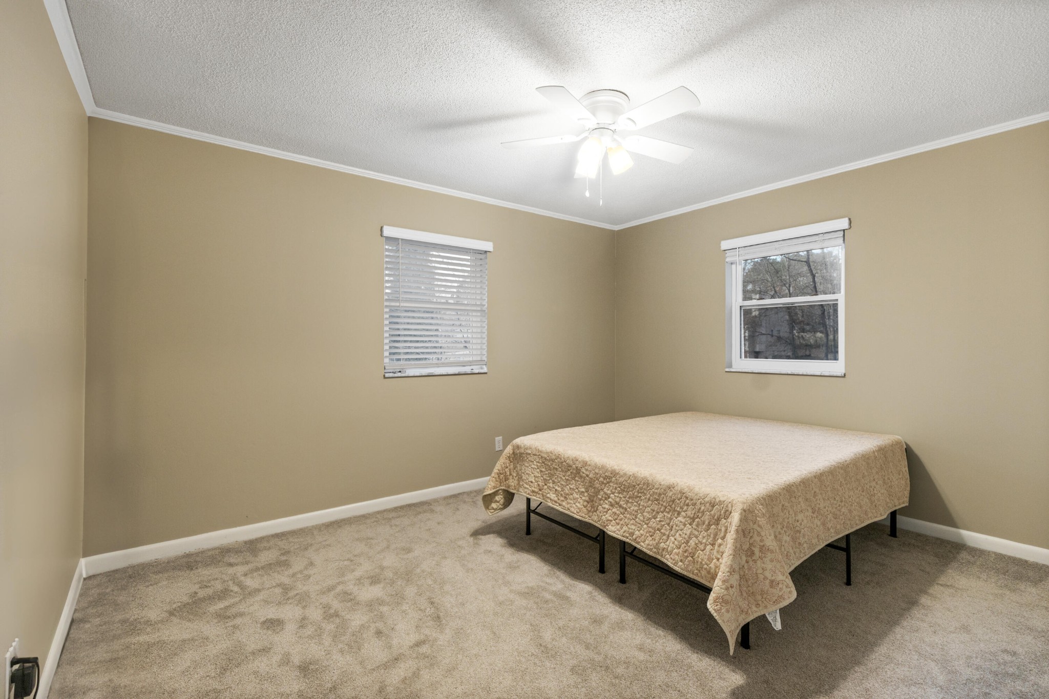 448 Apache Trail Northwest Cleveland, TN 37312 - Photo 14 of 38 a bed sitting in a bedroom next to a window