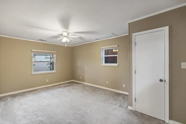 a view of room with window and ceiling fan