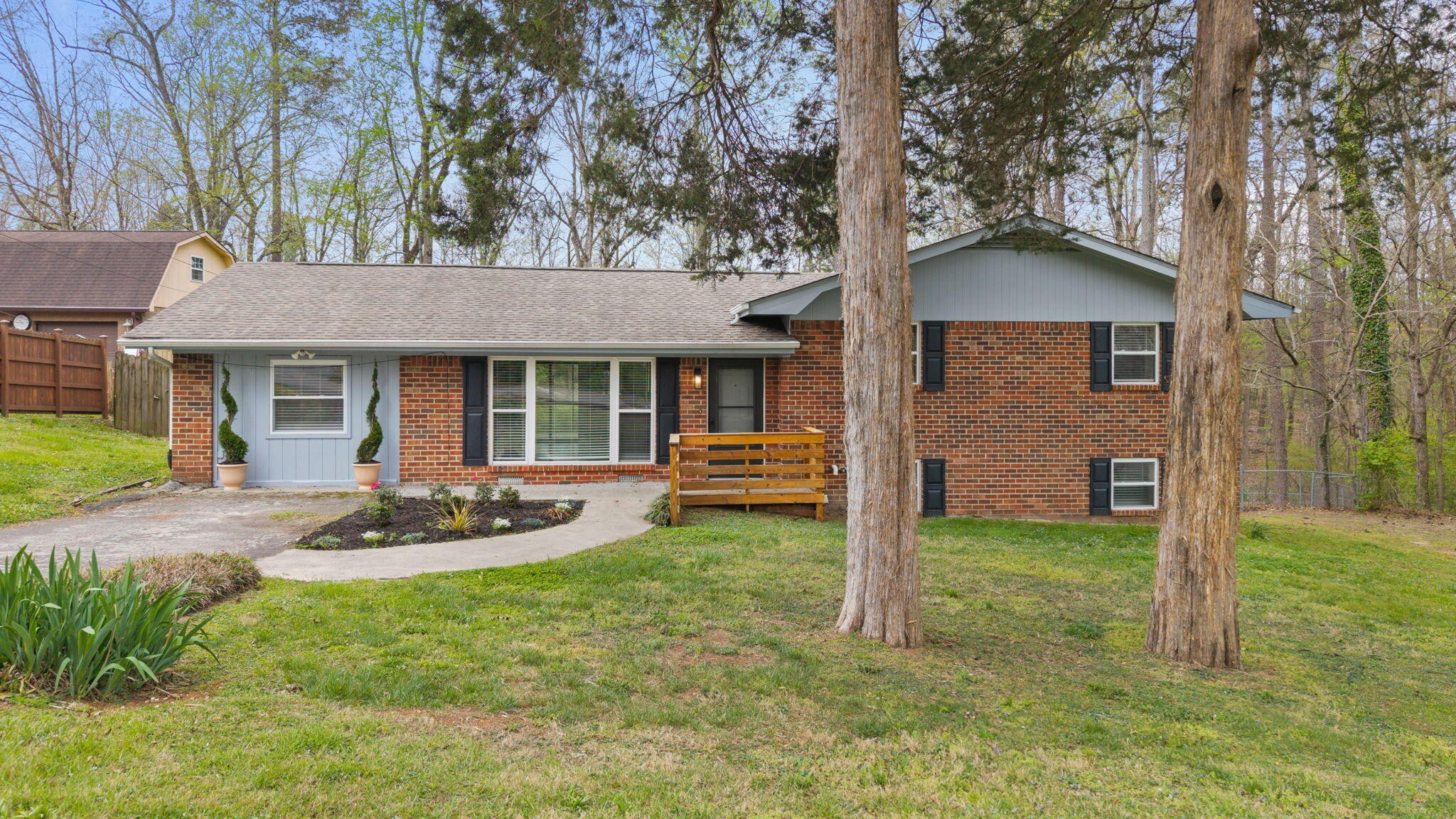 448 Apache Trail Northwest Cleveland, TN 37312 - Photo 2 of 38 a house view with a sitting space and garden