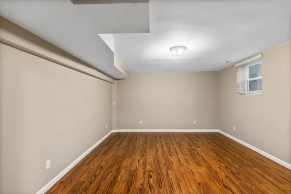 a view of room with wooden floor