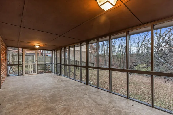 a view of empty room with windows