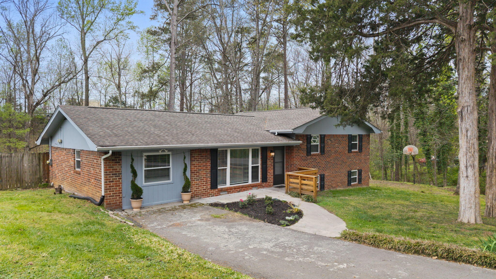 448 Apache Trail Northwest Cleveland, TN 37312 - Photo 37 of 38 a front view of a house with a yard and garage