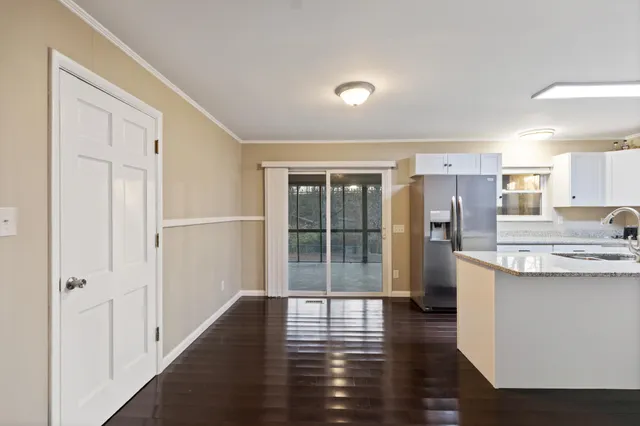 a view of a kitchen with a sink and a window