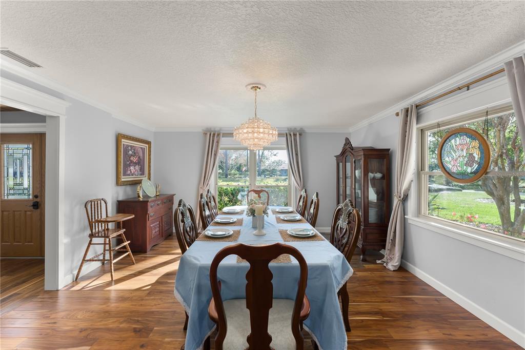 1209 Roxboro Road Longwood, FL 32750 - Photo 13 of 74 a view of a dining room with furniture window and wooden floor