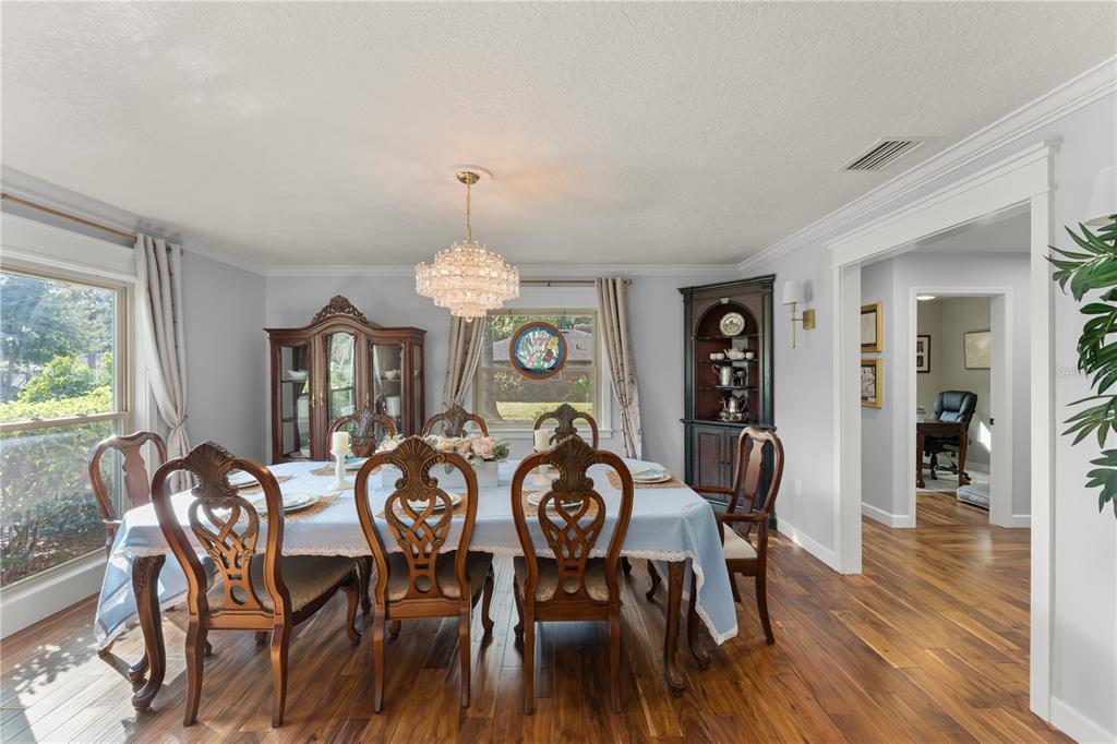 1209 Roxboro Road Longwood, FL 32750 - Photo 14 of 74 a view of a dining room with furniture window and wooden floor