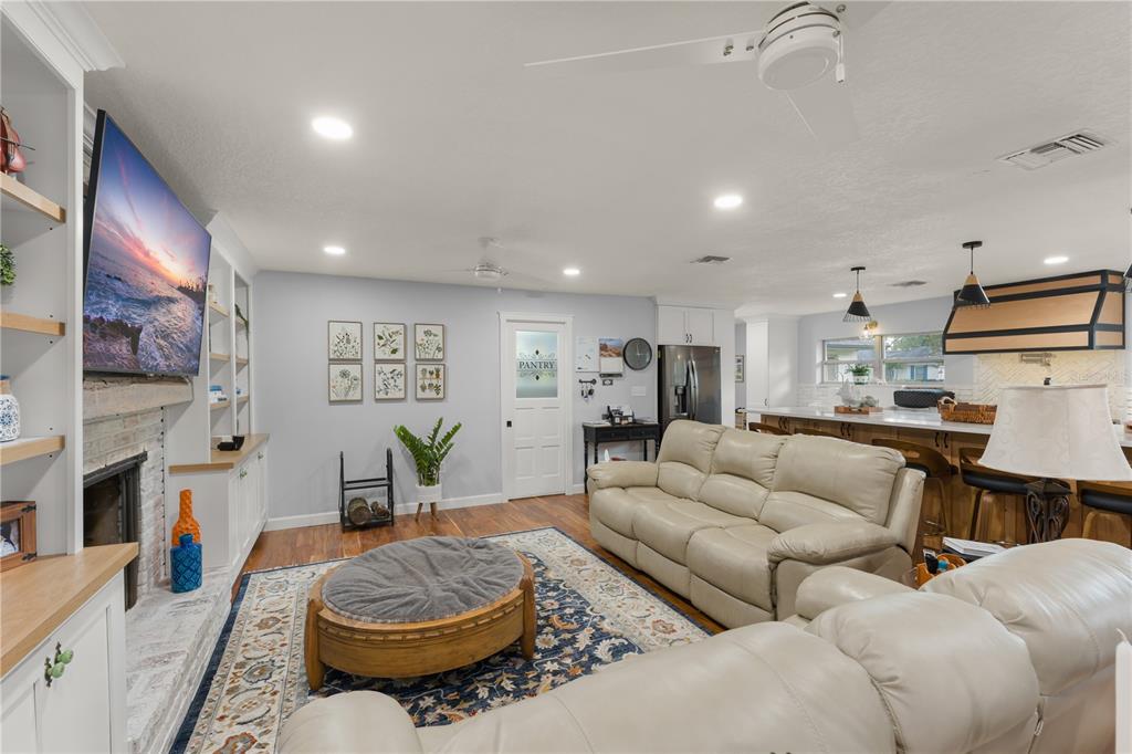 1209 Roxboro Road Longwood, FL 32750 - Photo 19 of 74 a living room with furniture and a flat screen tv