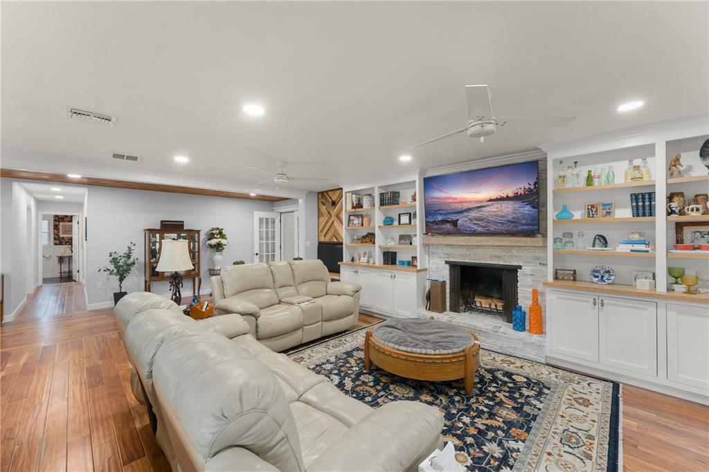1209 Roxboro Road Longwood, FL 32750 - Photo 20 of 74 a living room with furniture and a fireplace
