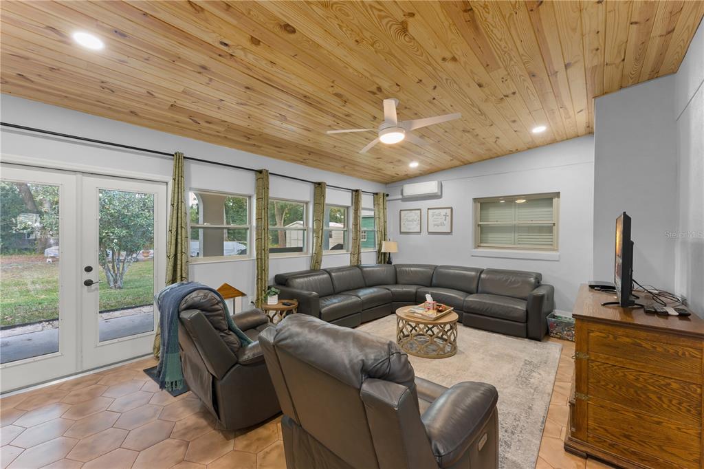 1209 Roxboro Road Longwood, FL 32750 - Photo 22 of 74 a living room with furniture and a flat screen tv
