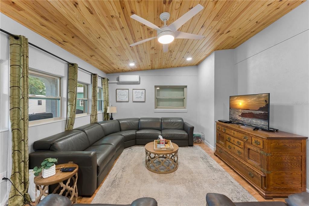 1209 Roxboro Road Longwood, FL 32750 - Photo 23 of 74 a living room with furniture and a flat screen tv
