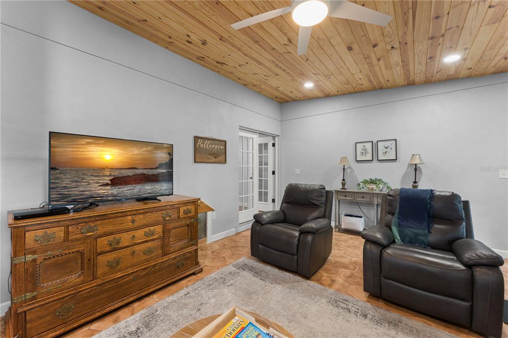 1209 Roxboro Road Longwood, FL 32750 - Photo 24 of 74 a living room with furniture and a flat screen tv