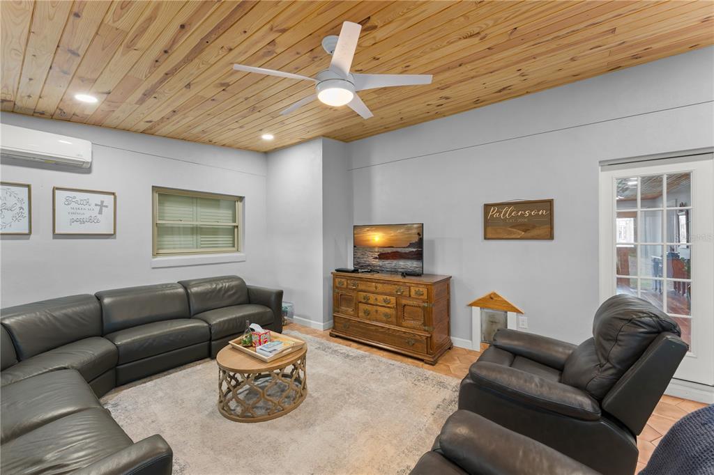 1209 Roxboro Road Longwood, FL 32750 - Photo 25 of 74 a living room with furniture and a flat screen tv
