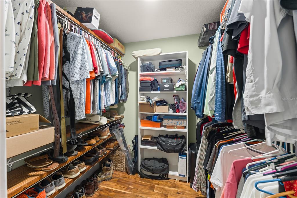 1209 Roxboro Road Longwood, FL 32750 - Photo 29 of 74 a view of walk in closet with clothes and shoes