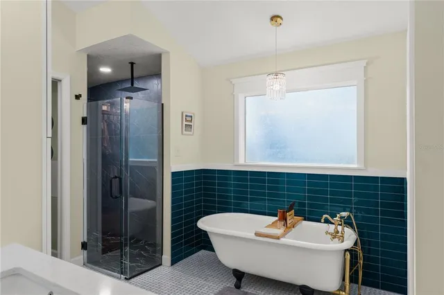 a living room with furniture window and flat screen tv