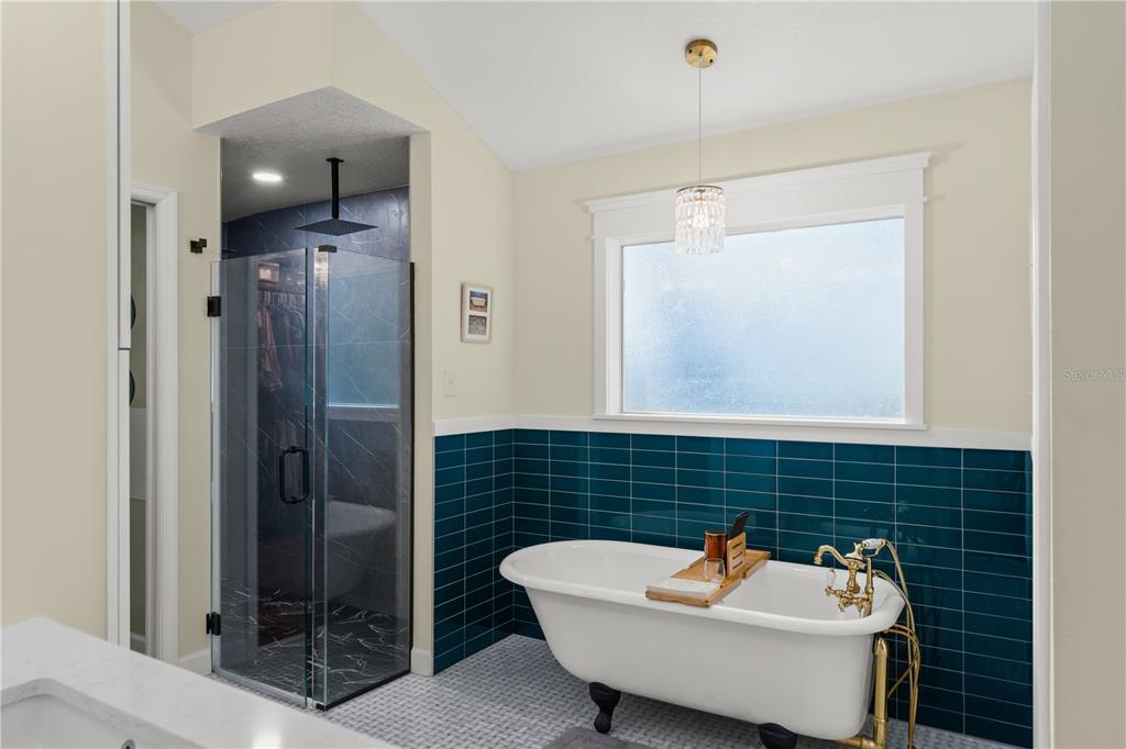 1209 Roxboro Road Longwood, FL 32750 - Photo 30 of 74 a bathroom with a sink a mirror and shower