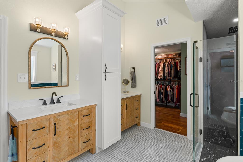 1209 Roxboro Road Longwood, FL 32750 - Photo 33 of 74 a en suite bathroom with a double vanity sink and a mirror