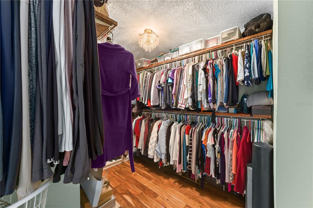 1209 Roxboro Road Longwood, FL 32750 - Photo 35 of 74 a view of walk in closet with clothes and shoes