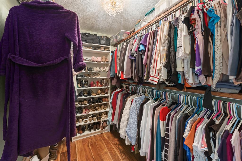 1209 Roxboro Road Longwood, FL 32750 - Photo 36 of 74 a view of walk in closet with clothes and shoes