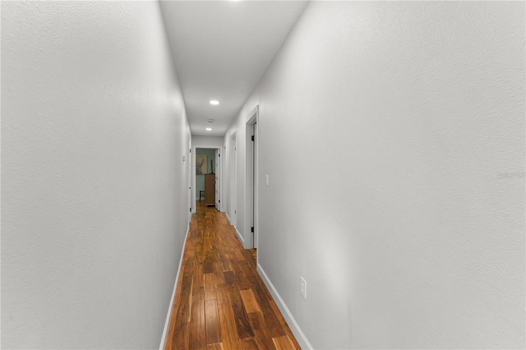 1209 Roxboro Road Longwood, FL 32750 - Photo 37 of 74 a view of a hallway with wooden floor