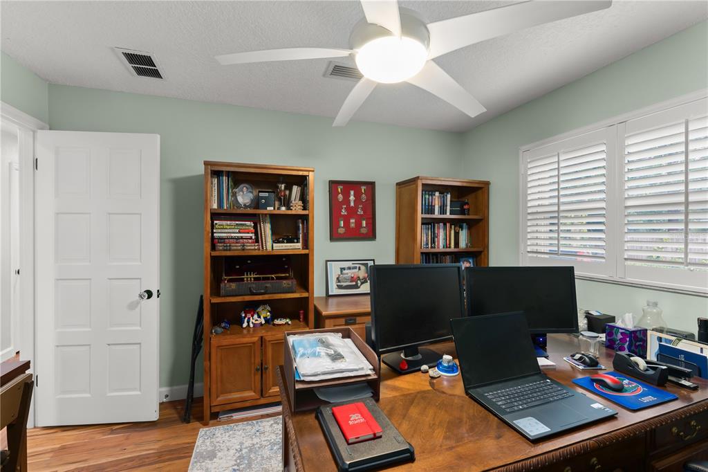 1209 Roxboro Road Longwood, FL 32750 - Photo 40 of 74 a view of a workspace with furniture and a window