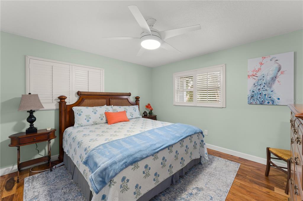 1209 Roxboro Road Longwood, FL 32750 - Photo 44 of 74 a bedroom with a bed and a lamp on dresser