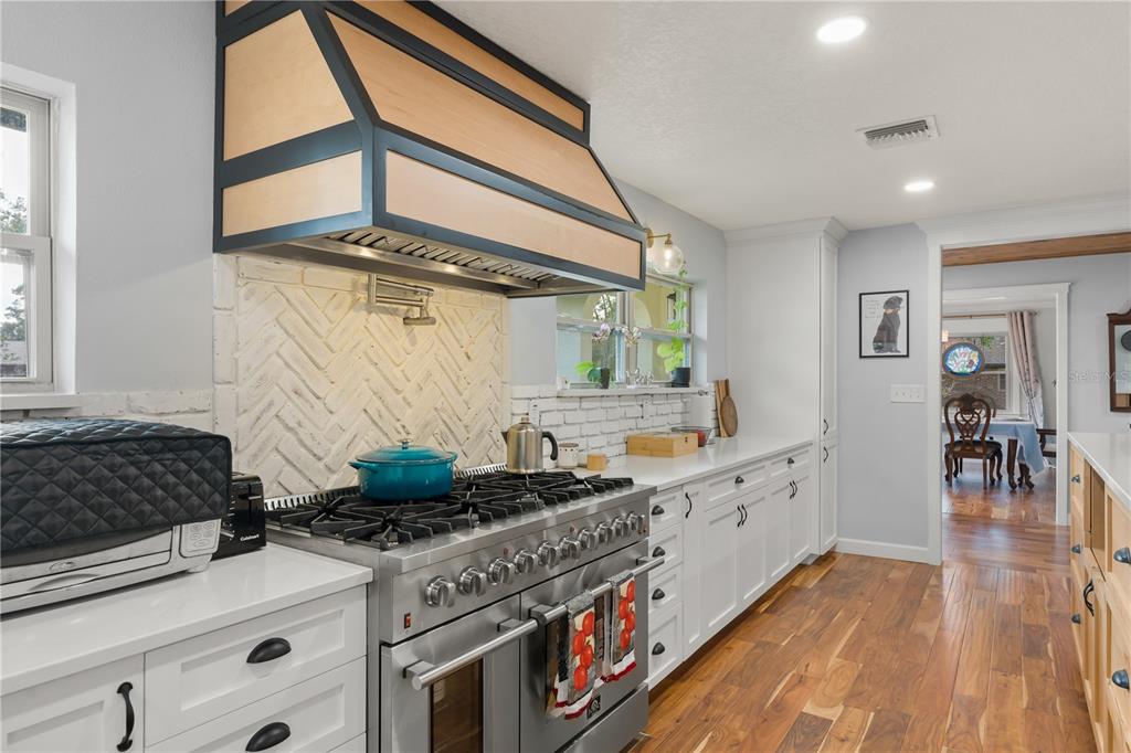 1209 Roxboro Road Longwood, FL 32750 - Photo 8 of 74 a kitchen with stainless steel appliances granite countertop a stove a sink and a refrigerator