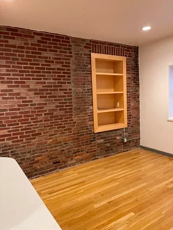 a view of door with wooden floor