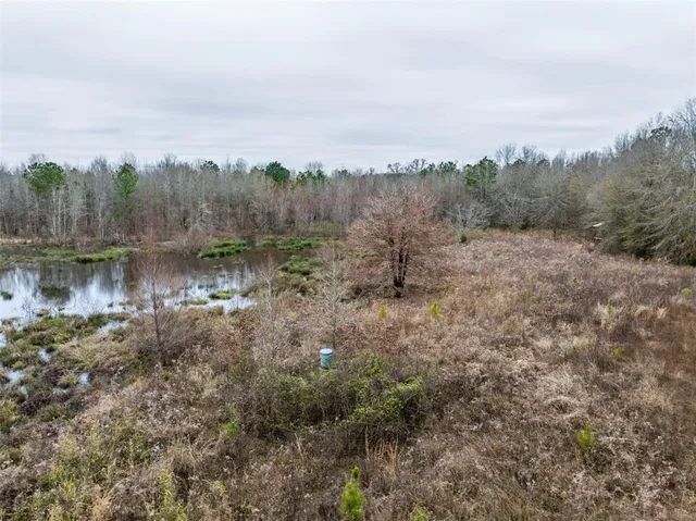 an aerial view of a houses with outdoor space