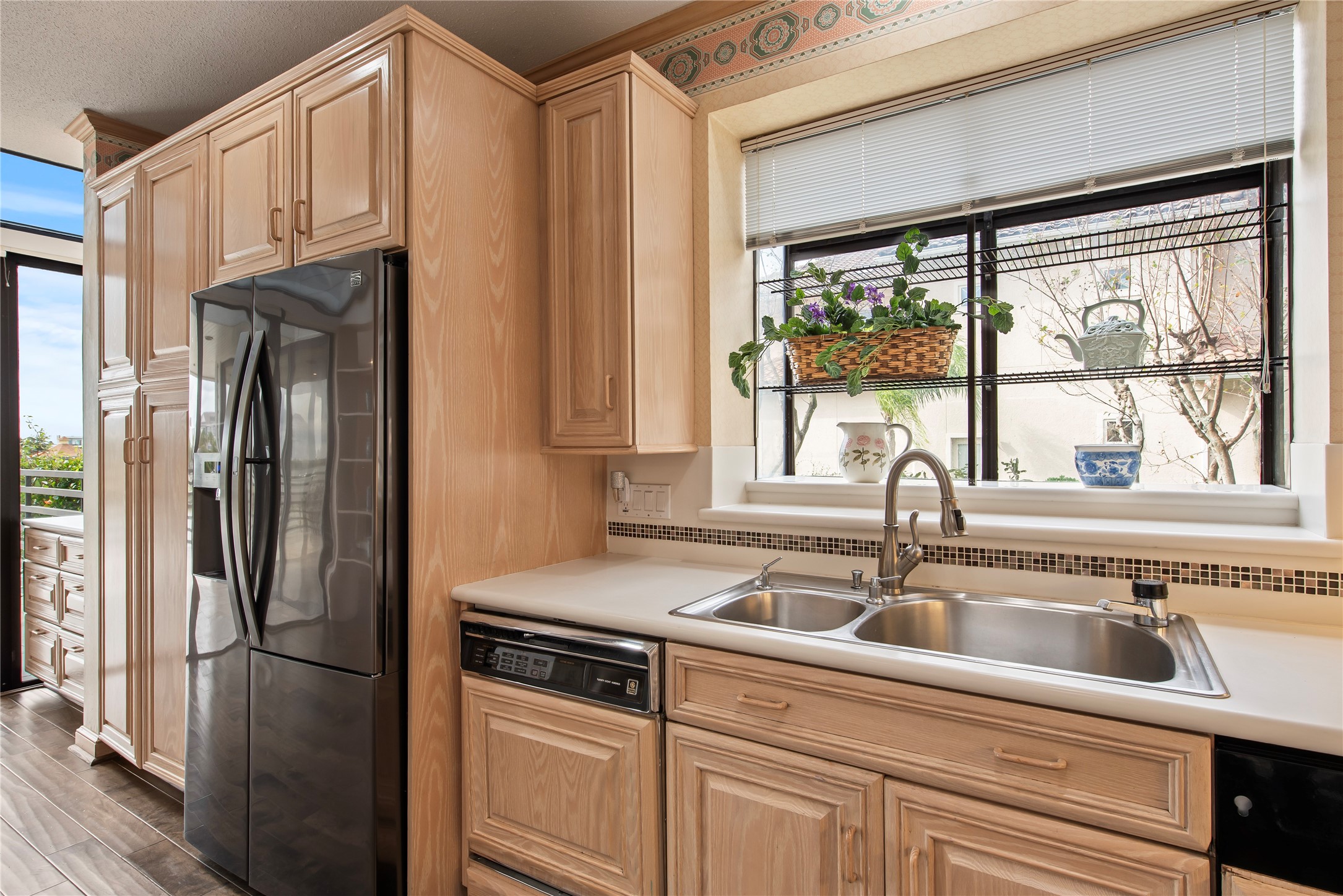2037 Enterprise Avenue League City, TX 77573 - Photo 16 of 49 a kitchen with stainless steel appliances a sink a refrigerator and window