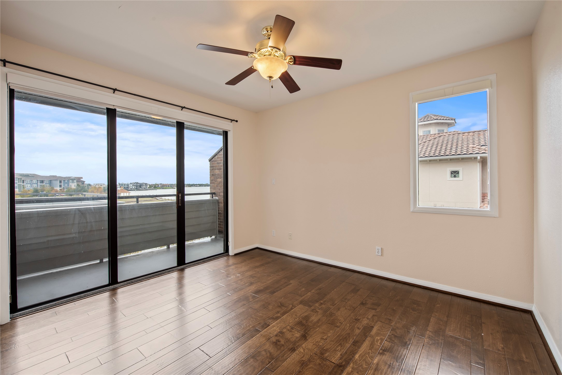 2037 Enterprise Avenue League City, TX 77573 - Photo 18 of 49 wooden floor in an empty room with a window