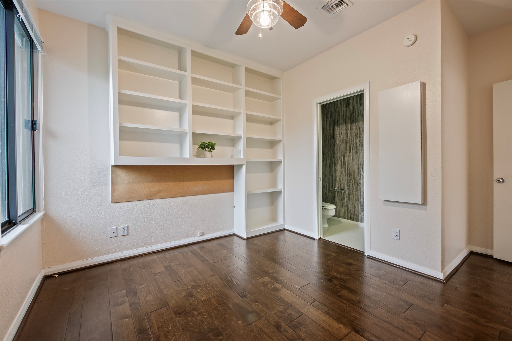 2037 Enterprise Avenue League City, TX 77573 - Photo 20 of 49 a view of an empty room with a window and wooden floor
